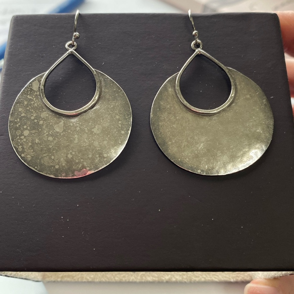 Made-by-hand hammered silver earrings.